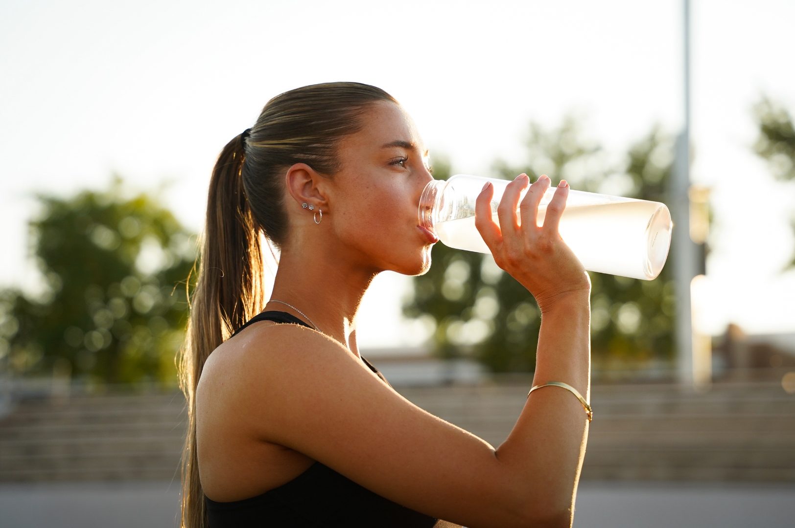 Woman hydrating after training